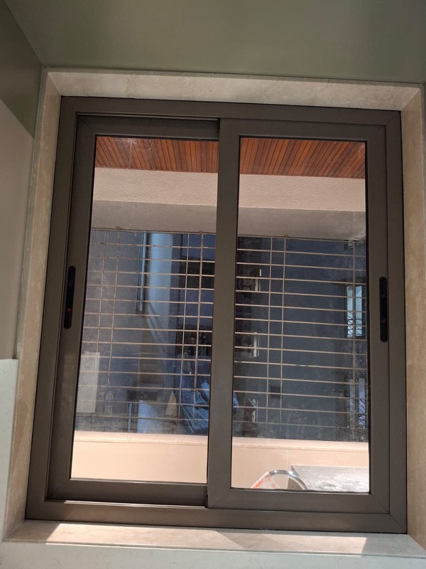 Grey aluminium sliding window kitchen Mumbai by Vishwa Windows
