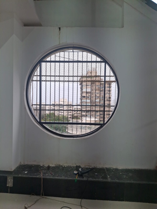 Round window safety grill pigeon net Mumbai by Vishwa Windows